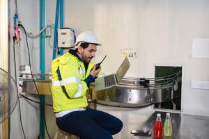 caucasian engineer man safety uniform checking reporting quality bottled fruit conveyor belt processing plant 49071 8716 1