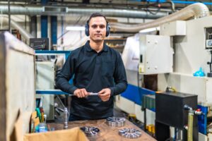 man using micrometer protective headphones metal factory 242111 42749 1