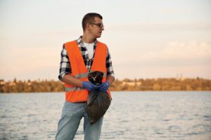 man volunteer is against earth pollution by trash outdoors 146671 145499