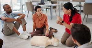 people mannequin first aid office learning cpr workshop safety demonstration design team medic dummy agency life saving procedure emergency practice employee engagement 590464 525173 1