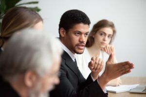 serious african american ceo giving instructions diverse team meeting confident black leader talking delegating work serious darkskinned executive manager speaking appealing colleagues group 650366 8473