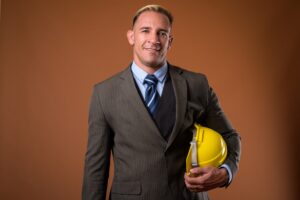 studio shot construction businessman holding hardhat 251136 31828
