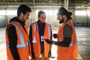 three happy young male workers warehouse discussing presentation points 274679 44685