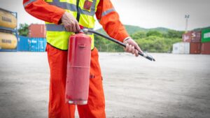 foreman training using fire extinguisher large cargo container forklift warehouse training using fire extinguisher cargo port forklift 33850 2924