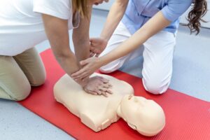 nursing students are learning how rescue patient emergency cpr training with cpr doll closedup soft focus 1212 5555