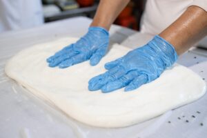 top view experienced food factory worker making quality rolled cheese 308072 7887